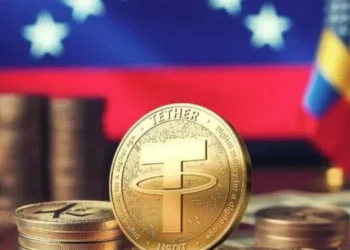 Moneda de USDT sobre una bandera venezolana