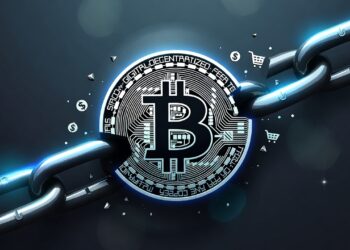 Logo de bitcoin en medio de una cadena rota.