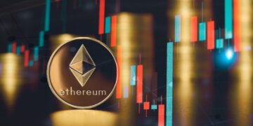 Una moneda física de Ethereum junto a otras monedas y gráficos de precios.