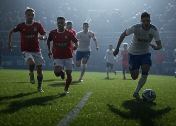 Jugadores de fútbol disputan un partido.