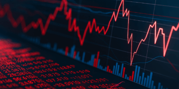 Gráfico financiero en caída con líneas rojas descendentes y datos bursátiles