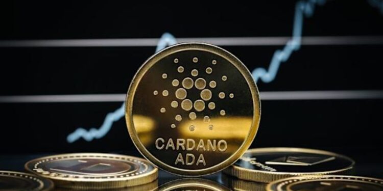 Moneda física de ADA en un escritorio, con fondo negro y una línea de gráfico en blanco.