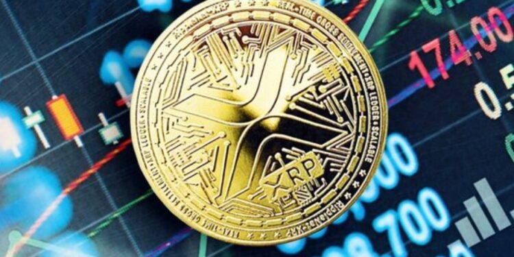 Moneda física de XRP sobre un panel electrónico.