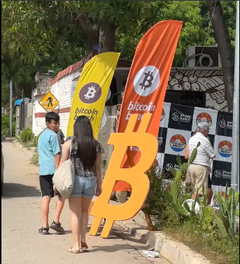 Banners with bitcoin logos and a giant B for BTC on the streets of El Zonte in El Salvador.