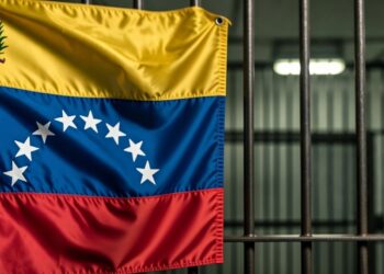 Bandera de Venezuela junto a barras de prisión.
