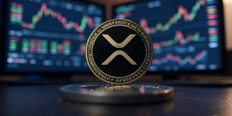 Una moneda física de XRP delante de dos pantallas que muestran gráficos de precio.