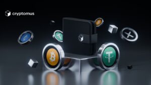 Criptomonedas de bitcoin y Tether sobre una mesa con un billetera negra sobre ellas.