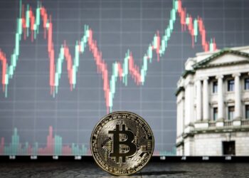 Moneda de bitcoin, gráfico de precio volátil y el banco central de Japón