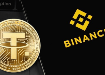 Telefono con el logo de binance y al lado una moneda dorada con el símbolo de Tether (USDT)