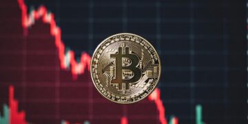 moneda de bitcoin y gráfico de precio en caída rojo.