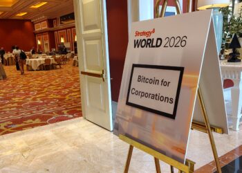 Letrero de Bitcoin for Corporations en el evento.