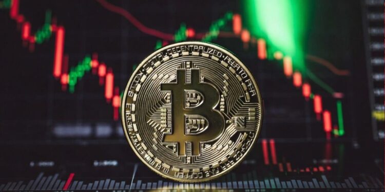 Moneda física de bitcoin con un fondo de gráfico de precios.