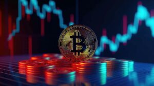 Monedas de bitcoin físicas en primer plano con un gráfico de precio en el fondo.