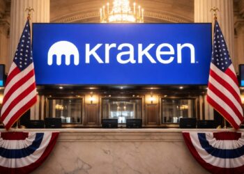 Imagen del logo del exchange Kraken en un sistema bancario con la bandera de EE. UU.