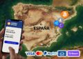 Teléfono celular y criptomonedas sobre el mapa de España al fondo.