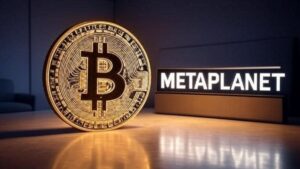 Moneda física de bitcoin junto a un letrero de Metaplanet.