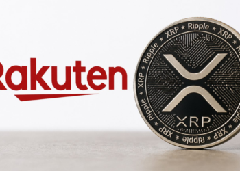 El logo de Rakuten junto a una moneda física de XRP.