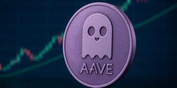 Moneda de Aave en primer plano y al fondo una gráfica bursátil.