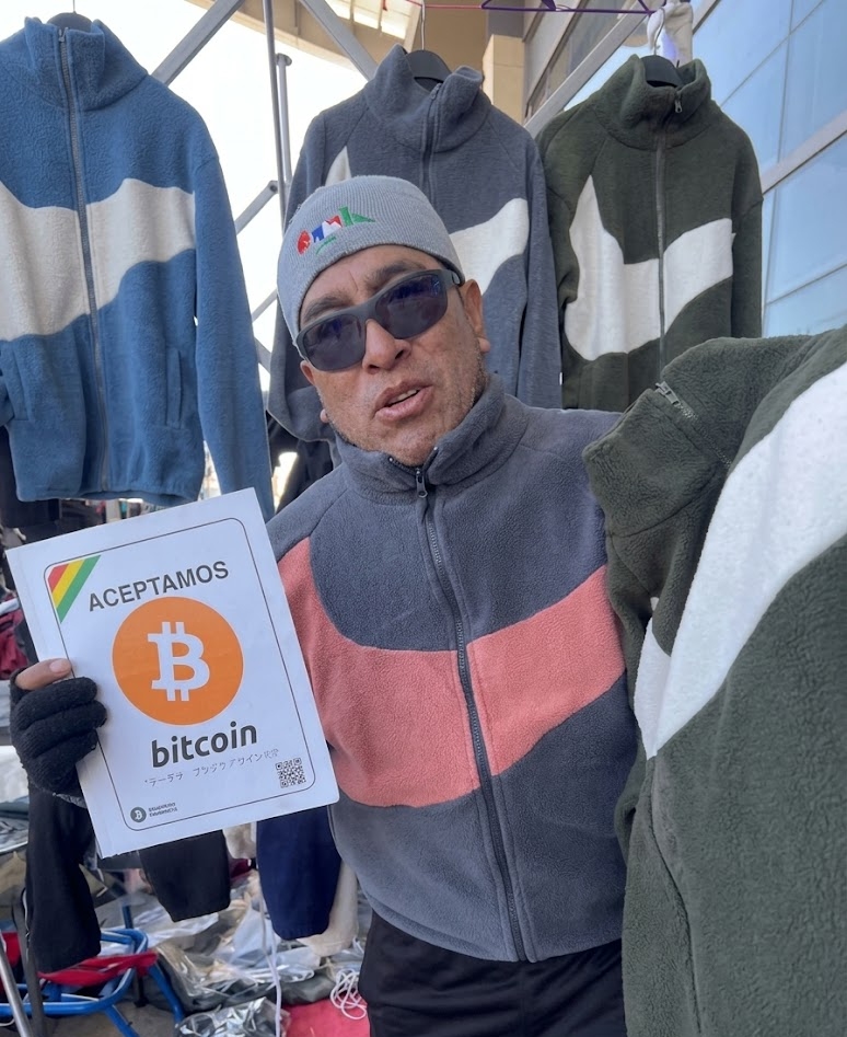 Photograph of a street vendor accepting BTC in Bolivia.