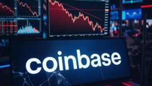 Gráficos bursátiles rojos en fuerte descenso en una sala de trading con el logo de Coinbase en primer plano.