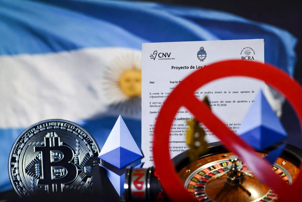 Imagen estilo realista con bandera argentina, símbolos de criptomonedas, elementos de apuestas bloqueados y un documento oficial de la ley.