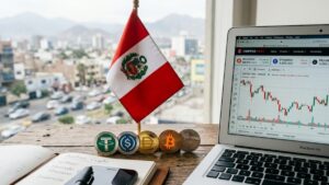 Stablecoins y criptomonedas, junto a la bandera de Perú sobre un escritorio.