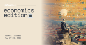 Banner de "bitcoin++ economics edition" en Viena, mostrando una estatua mirando hacia la ciudad.