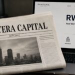Un diario de Pantera Capital junto a un monitor que muestra RWA.