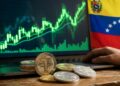 Monedas de USDT con el fondo gráficas verdes y la bandera de Venezuela