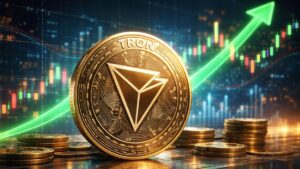 Moneda física de Tron (TRX) frente a gráficos alcistas de criptomonedas en un entorno financiero digital.