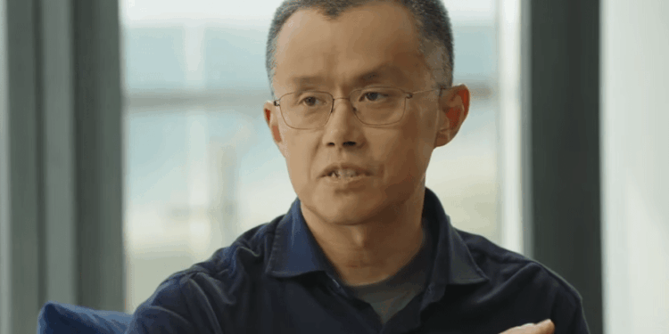 Fotografía de primer plano de Changpeng Zhao (CZ), fundador de Binance, vistiendo una camisa oscura y hablando durante una entrevista en Abu Dabi.