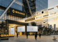 Edificio de Binance y muchos logos de acciones conocidas.