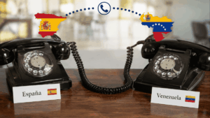 Dos teléfonos conectados entre sí, uno tiene un letrero que dice "España", el otro tiene un letrero que dice "Venezuela".