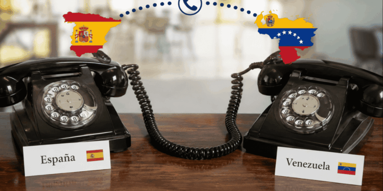 Dos teléfonos conectados entre sí, uno tiene un letrero que dice "España", el otro tiene un letrero que dice "Venezuela".