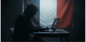 Un hacker. De fondo, la bandera de Francia.