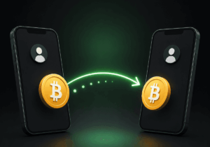 Dos celulares intercambian bitcoins mediante una transferencia digital.