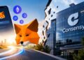 Smartphone con MetaMask e iconos de criptomonedas junto al logotipo de Consensys separado por una grieta.